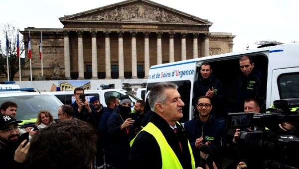 France's Snowballing Discontent: Ambulances Block Assembly.
