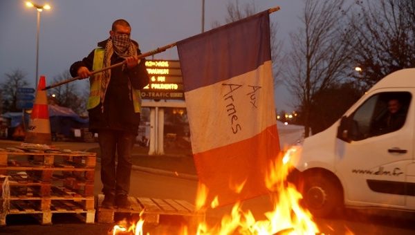 French government bows to protesters, suspends fuel tax rise for next six months. 