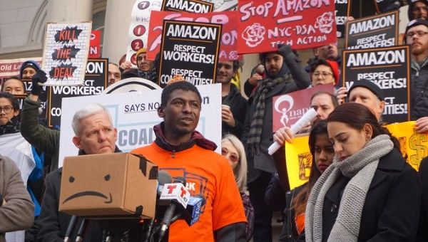 Demonstrators rallies outside of NYC's City Hall to speak out against working conditions and unfair practices by the company.