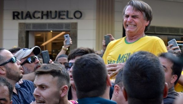 Brazilian President-elect Jair Bolsonaro reacts after being stabbed during a campaign rally in Minas Gerais state, Brazil, Sep. 6, 2018