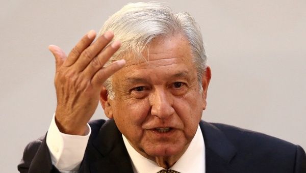 Mexico's President Andres Manuel Lopez Obrador gestures during a meeting with industry bosses and members of his cabinet to discuss the new administration's policy on the minimum wage at National Palace in Mexico City