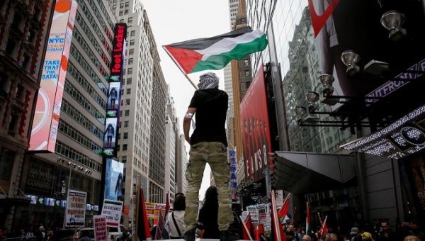 A demonstrator waves a Palestine flag during a pro-Palestine rally in New York City, U.S., May 18, 2018.