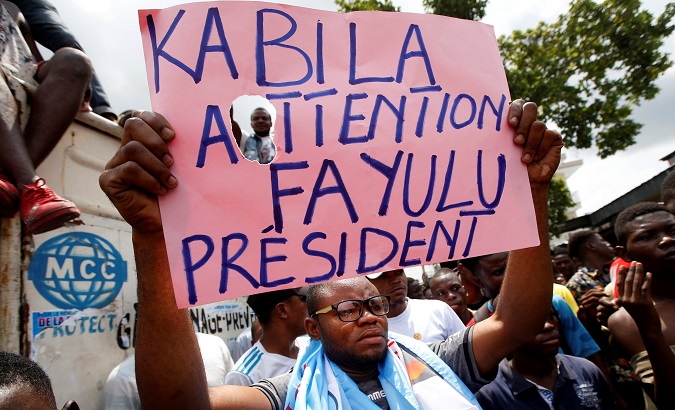 Supporter of Martin Fayulu displays a sign in Kinshasa, Democratic Republic of Congo, January 11, 2019.