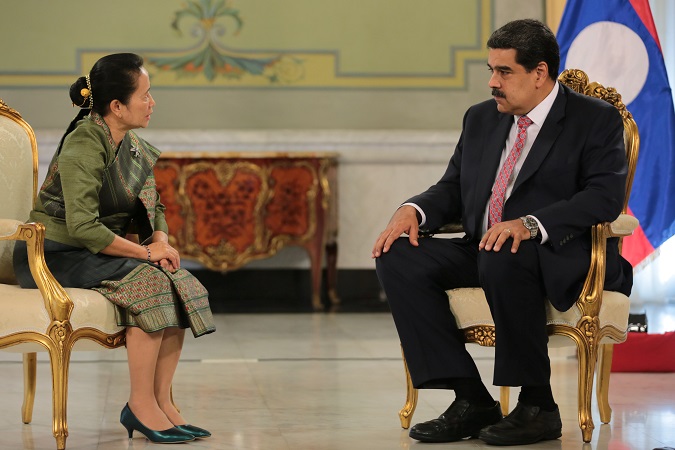 Venezuela's President Nicolas Maduro attends a ceremony with Laos' new ambassador to Venezuela Anouphone Kittirath, to receive her diplomatic credentials in Caracas