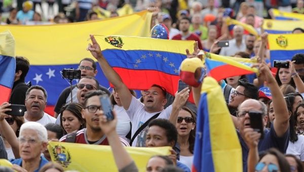 People attend protests and rallies throughout Venezuela Saturday, Feb. 2, 2019.