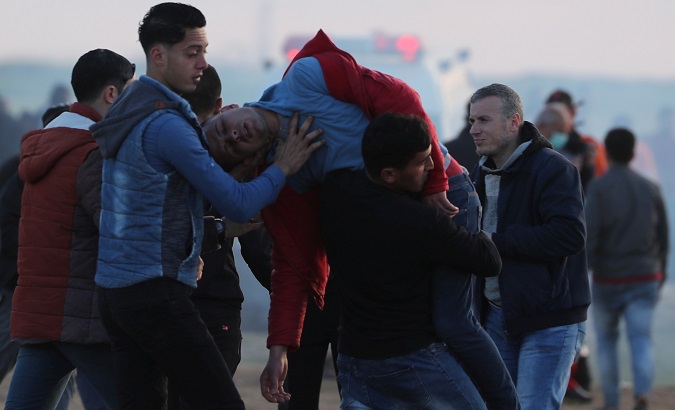 A wounded Palestinian is evacuated during a protest at the Israel-Gaza border fence, east of Gaza City Feb. 22, 2019.