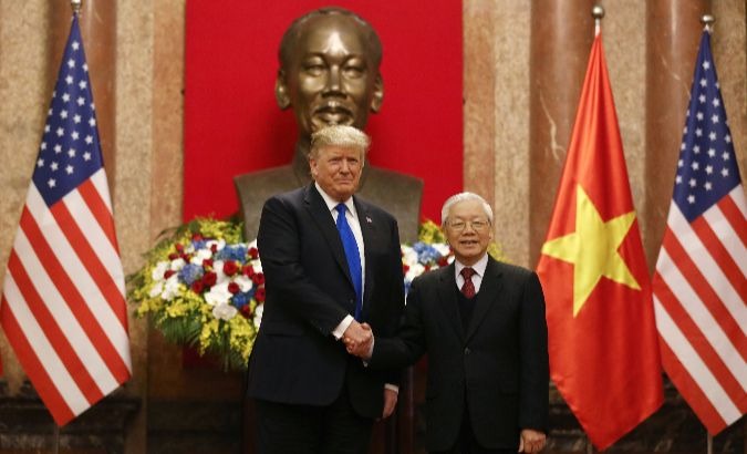 Trump holds bilateral talks with Vietnamese President Nguyen Phu Trong (R) ahead of summit.