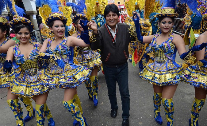 Bolivian President Evo Morales dances with youth of the dance of Morenada Feb. 18, 2012,