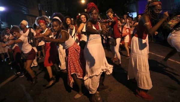 Women dance during a protest against Brazil President Jair Bolsonaro in Sao Paulo, Brazil March 8, 2019.