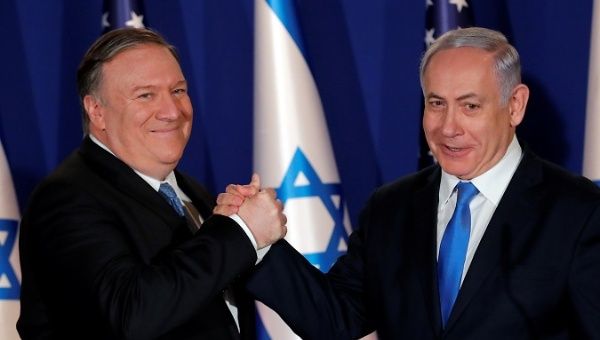 U.S. Secretary of State Mike Pompeo shake hands with Israeli Prime Minister Benjamin Netanyahu, during their visit at Netanyahu's official residence in Jerusalem
