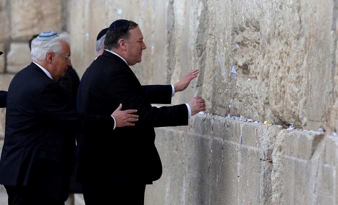Israeli Prime Minister Benjamin Netanyahu, U.S. Secretary of State Mike Pompeo and U.S. Ambassador to Israel David Friedman touch the stones of the Western Wall during a visit to the site in Jerusalem's Old City March 21, 2019.