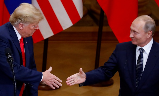 FILE PHOTO: U.S. President Donald Trump and Russian President Vladimir Putin shake hands at joint news conference in Helsinki, Finland, July 16, 2018.