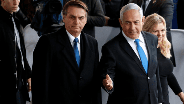 Israeli Prime Minister Benjamin Netanyahu next to Brazilian President Jair Bolsonaro (l) during a welcoming ceremony upon his arrival in Israel, at Ben Gurion International airport in Lod, near Tel Aviv, Israel March 31, 2019