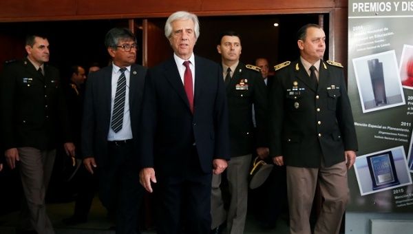 Uruguayan President Tabare Vazquez and General Claudio Feola walks after Feola's designation as new Commanding General of the Uruguayan Army in Montevideo, Uruguay April 8, 2019.