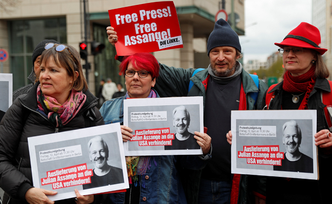 Supporters of WikiLeaks founder Julian Assange protest against his arrest, near the British embassy in Berlin. April 11, 2019