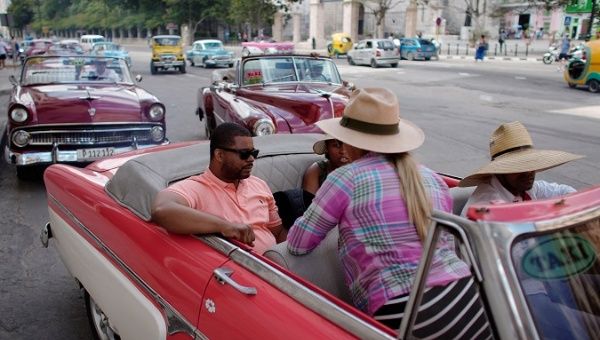 Cruise ship tourists prepare to ride in a vintage car in Havana, Cuba, June 5, 2019.