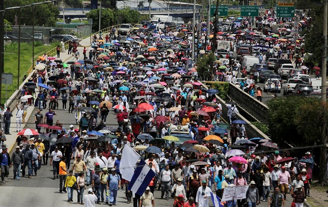 Demonstrators march against President Juan Orlando Hernandez government's plans to privatize healthcare and education, in Tegucigalpa, Honduras June 3, 2019.