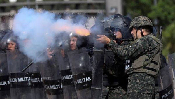Military police shoot tear gas at university students in Tegucigalpa, Honduras, June 24, 2019.
