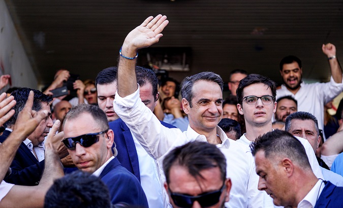 New Democracy conservative party leader Kyriakos Mitsotakis waves at supporters after voting at a polling station, during the general election in Athens, Greece, July 7, 2019.