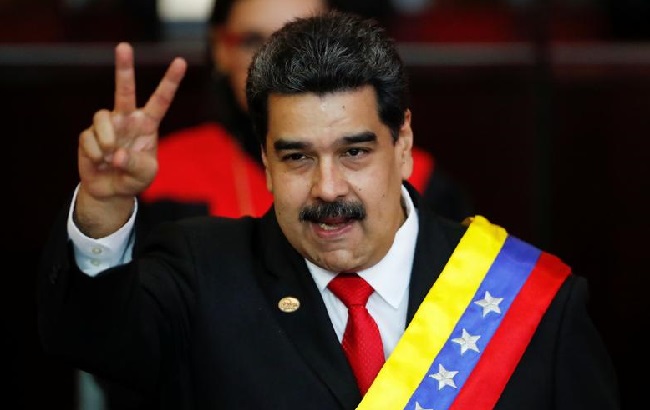 Venezuelan President Nicolas Maduro gestures after receiving the presidential sash during the ceremonial swearing-in ceremony in Caracas.