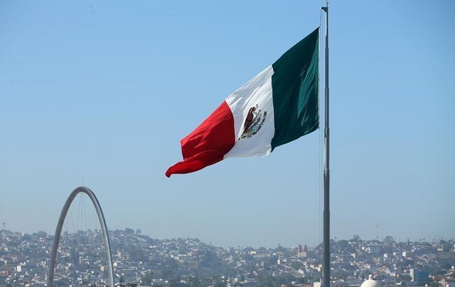 A Mexican flag is seen over the city of Tijuana, Mexico from San Ysidro.
