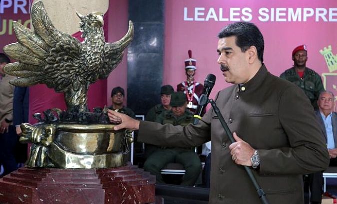 President Nicolas Maduro receives a sculpture of a phoenix from soldiers harmed in the Aug. 4 attack.