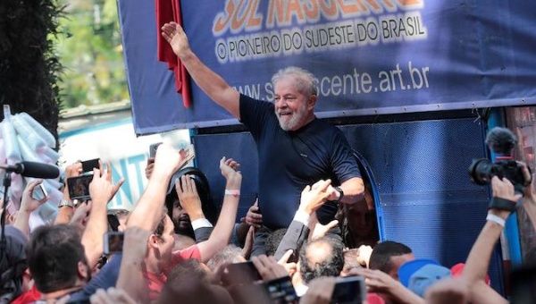 Former President Lula chants among his supporters before being arrested in April 2018.
