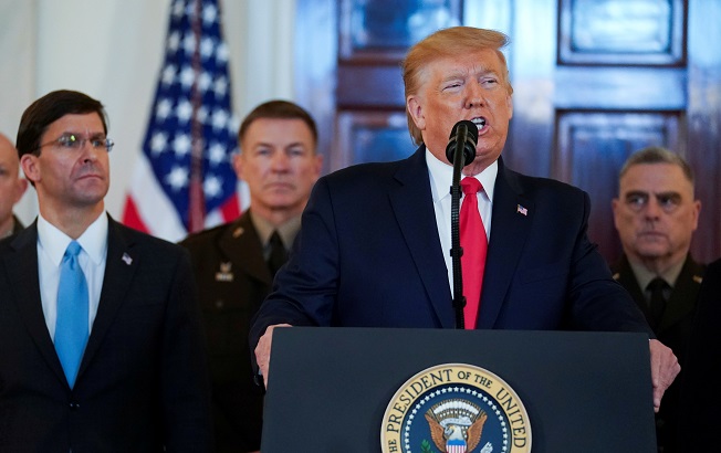 U.S. President Donald Trump delivers a statement about Iran flanked by U.S. Defense Secretary Mark Esper, Army Chief of Staff General James McConville and Chairman of the Joint Chiefs of Staff Army General Mark Milley in the Grand Foyer at the White House in Washington, U.S., January 8, 2020.