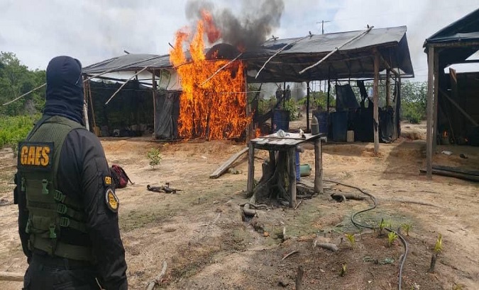 A drug processing camp burns in Zulia, Venezuela, July 27, 2020.