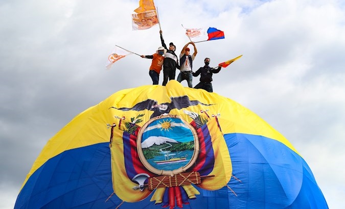 Young people waving Andres Arauz flags, El Arbolito park, Quito, Ecuador, Feb. 4, 2021.