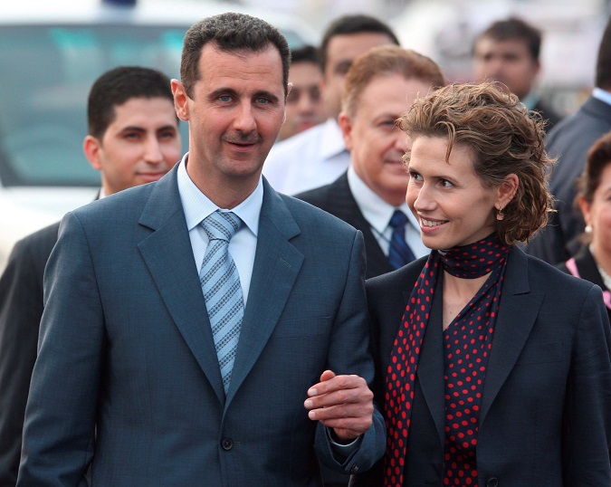 Archival image of Syrian President Bashar al-Assad (L) with his wife Asma al-Assad at New Delhi International airport, India. The Syrian Presidency has announced that the couple has tested positive for the SARS-CoV-2 coronavirus.