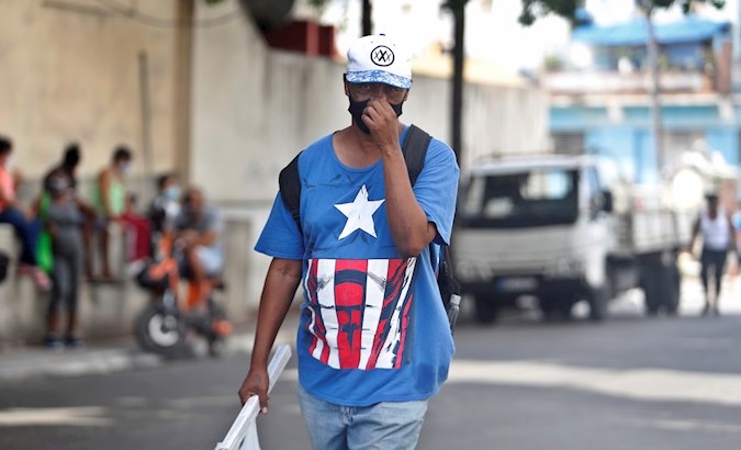 A man walks down a street, Havana, Cuba, June 10, 2021.