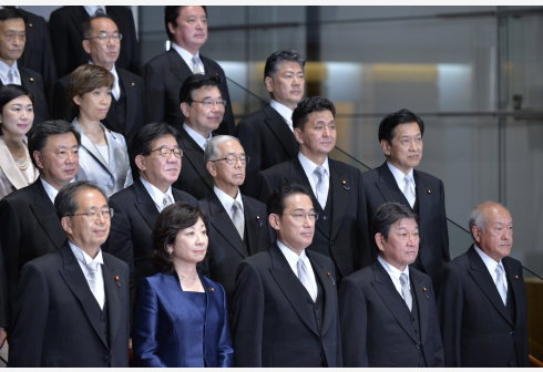 Japan's new Prime Minister Fumio Kishida (C, front) attends a photo session with his cabinet members at the prime minister's official residence in Tokyo, Japan, on Oct. 4, 2021.