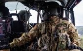 U.S. military inside a helicopter.