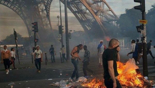 French citizens protest in front of the Eiffel tower, Paris, July 3, 2023.