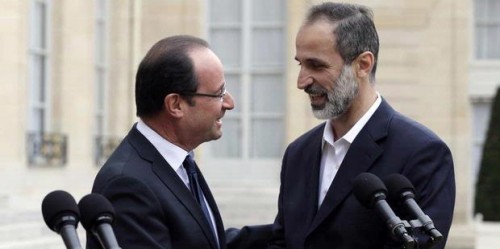 President Francois Hollande and Ahmed Moaz al-Khatib, leader of the Syrian separatists' coalition, meeting in Paris in November 2012 (archive)