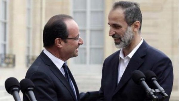 President Francois Hollande and Ahmed Moaz al-Khatib, leader of the Syrian separatists' coalition, meeting in Paris in November 2012 (archive)