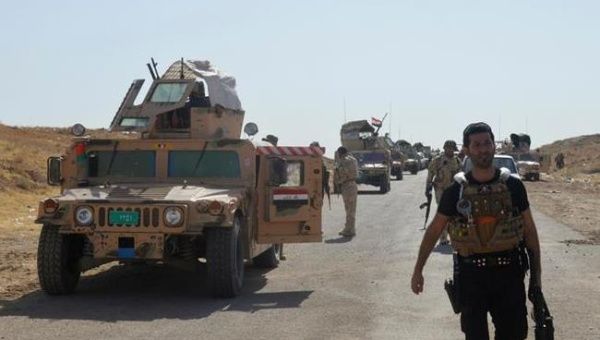 Military vehicles of Iraqi security forces are seen on a road during clashes with Islamic State (IS) militants. (Photo: Reuters)