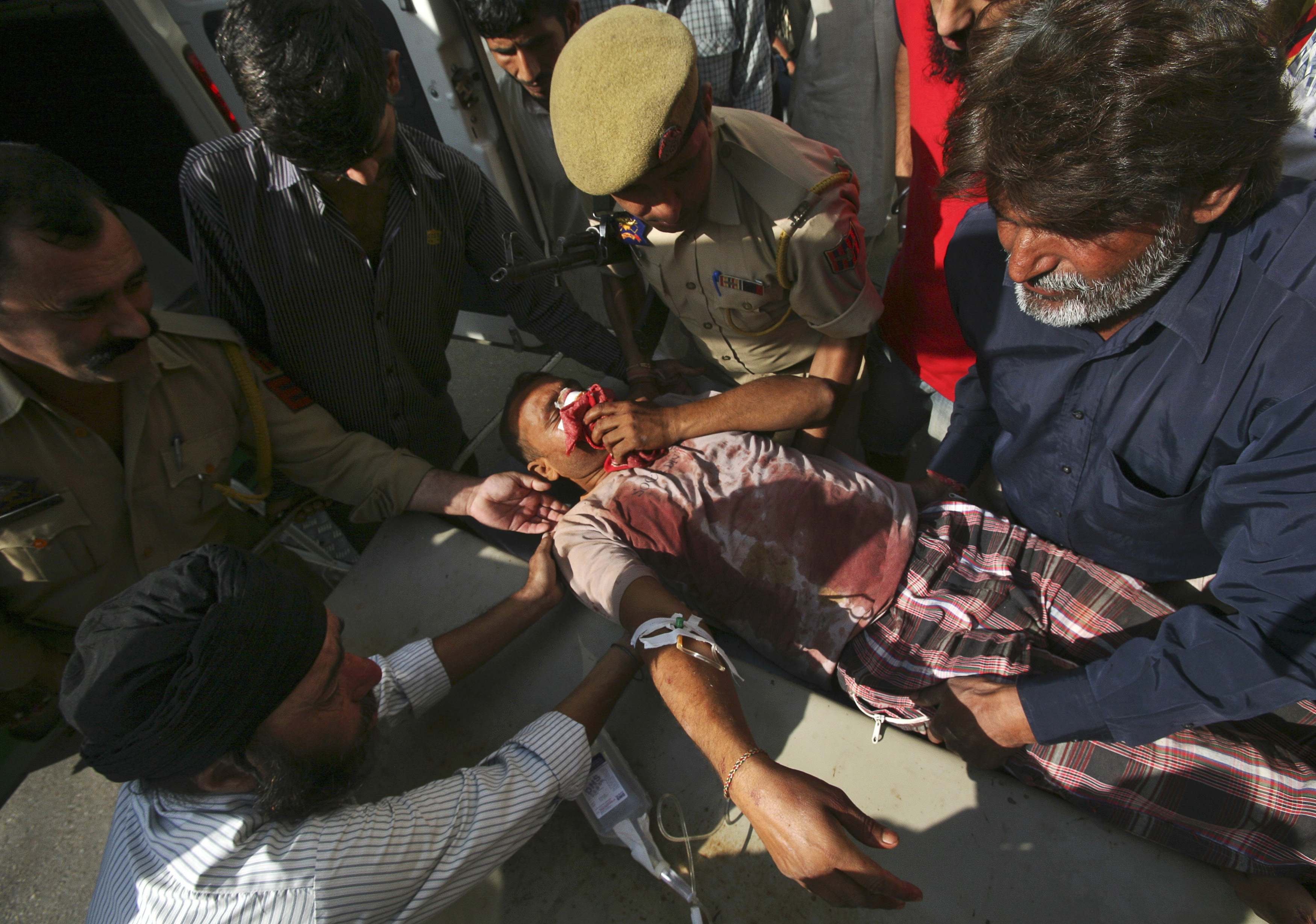 Surjeet Kumar, who locals said was injured during the recent exchange of fire between India and Pakistan, is rushed to a hospital in Jammu October 12, 2014. (Photo: Reuters)
