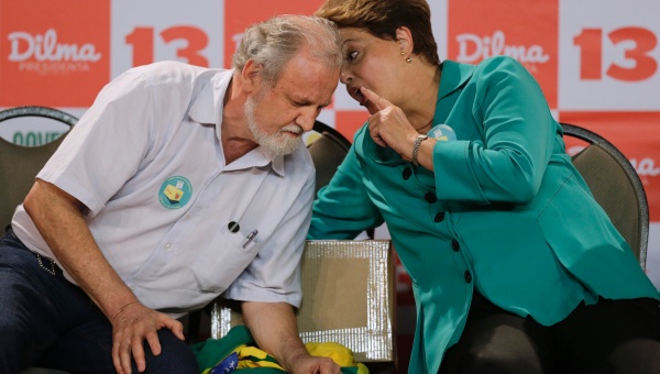 Brazil's President Dilma Rousseff speaks with Landless Workers Movement (MST) leader Joao Pedro Stedile (L) during a meeting with representatives of social movements in Brazil October 13, 2014. (Photo: Reuters)