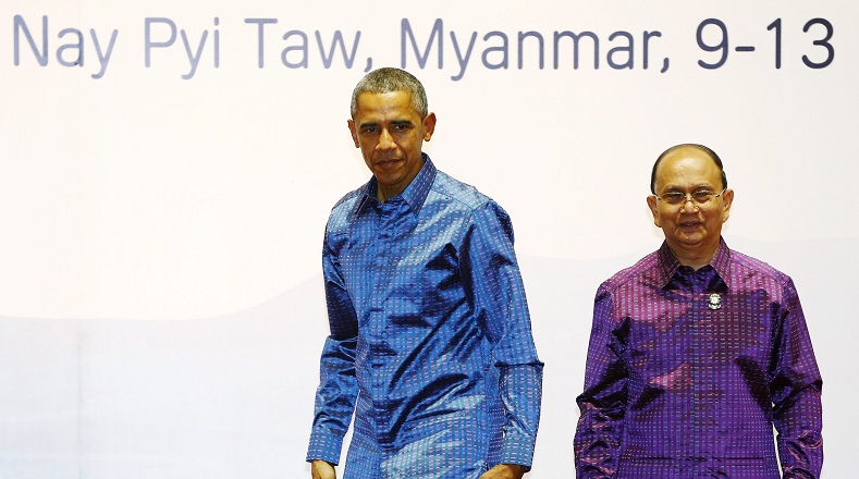 U.S. President Barack Obama (L) reacts after being welcomed by Myanmar's President Thein Sein (R) to the 25th Association of Southeast Asian Nations (ASEAN) summit in Naypyitaw November 12, 2014 (Photo: Reuters)