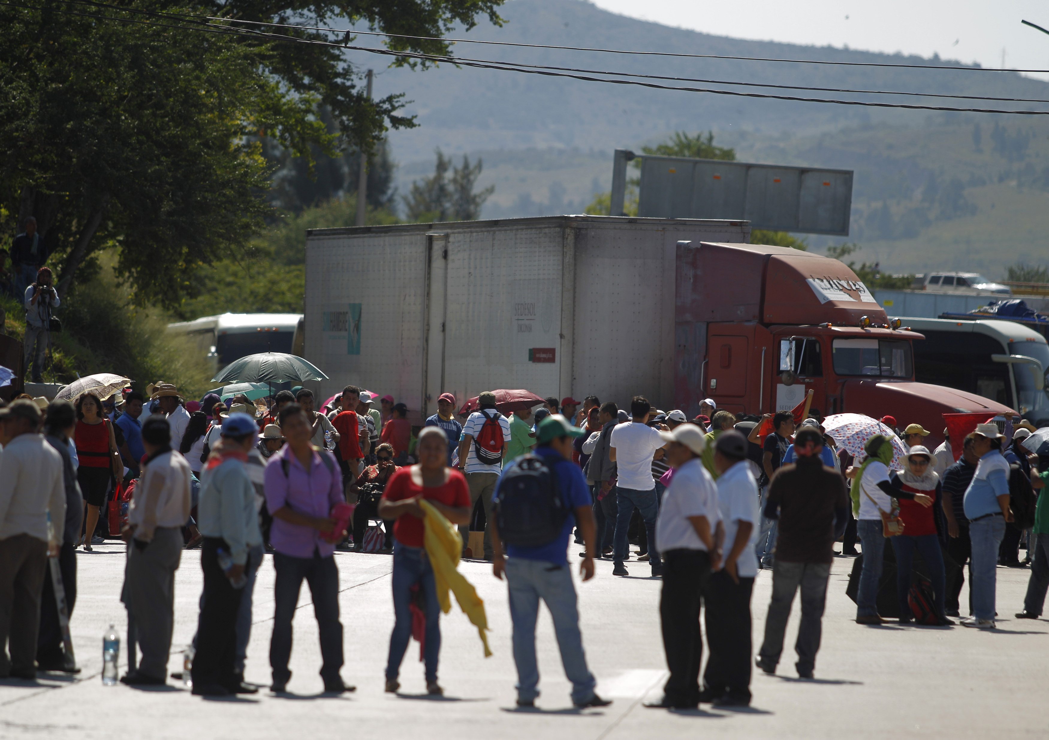 CETEG members (State Coordinator of Teachers of Guerrero) take part in a blockade on a road leading to Acapulco on the outskirts of Chilpancingo in Guerrero state, during a protest to show support for 43 missing students. (Photo: Reuters)