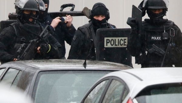 Armed French intervention police are seen at the scene of a shooting in the street of Montrouge near Paris January 8, 2015.