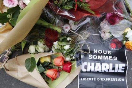 Flowers for the fallen in the attacks on Charlie Hebdo offices