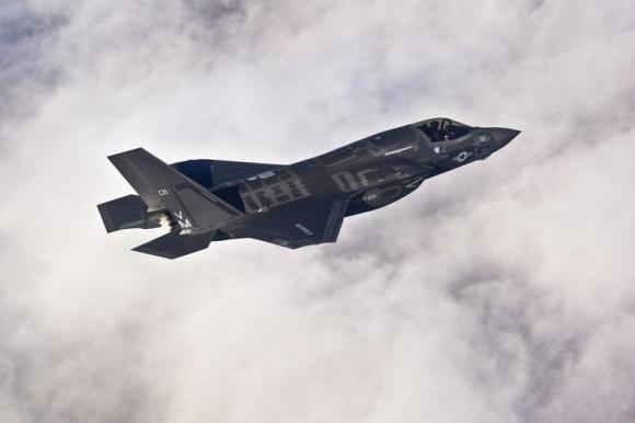 A Lockheed Martin F-35B Lightning II joint strike fighter flies toward its new home