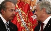 Former Mexican President Felipe Calderon (L) and Chile