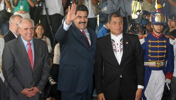 Nicolas Maduro (centre) with Rafael Correa (right) and Ernesto Samper (left) in Quito for the opening ceremony of the new UNASUR Headquarters Dec. 5, 2014.