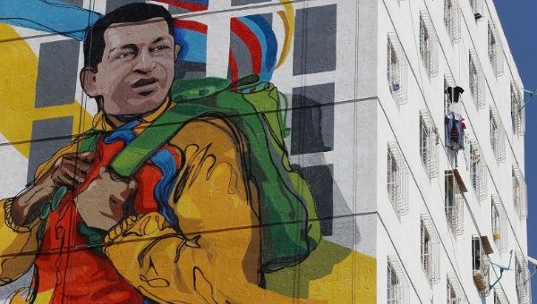 A massive mural of late Venezuelan President Hugo Chavez is seen on the wall of a new housing building built by the Venezuelan government, Feb. 8, 2015.