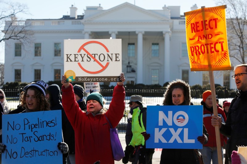 Activists hold a rally against government approval of the planned Keystone XL oil pipeline, in front of the White House in Washington January 10, 2015.