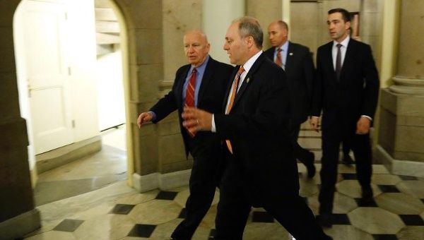 U.S. House Majority Whip Representative Steve Scalise (C) and Representative Kevin Brady (L) before votes on legislation to fund the Department of Homeland Security at the Capitol in Washington, Feb. 27, 2015.